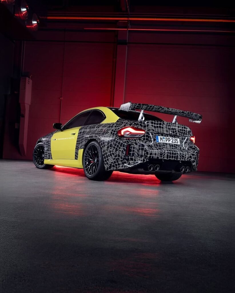 BMW M2 Track Package prototype with large rear wing and camouflaged rear spoiler