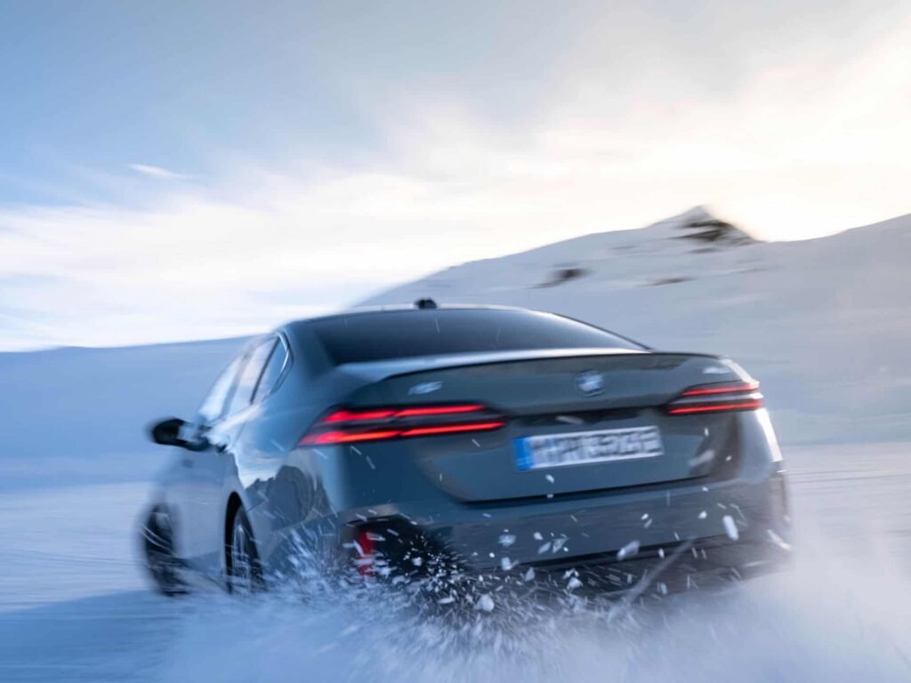 BMW i5 driving in the snow