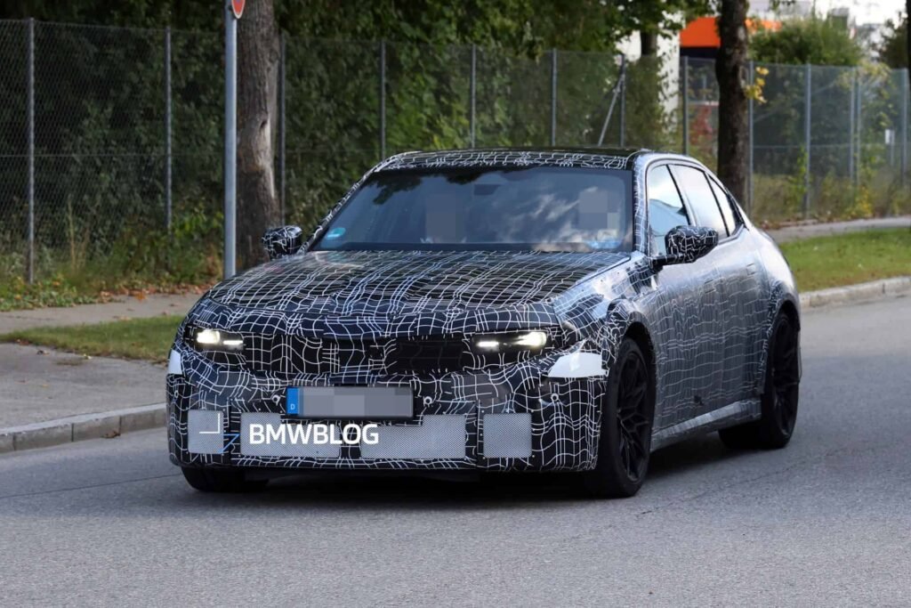 2028 BMW M3 G84 prototype with plastic camouflage and widened fenders
