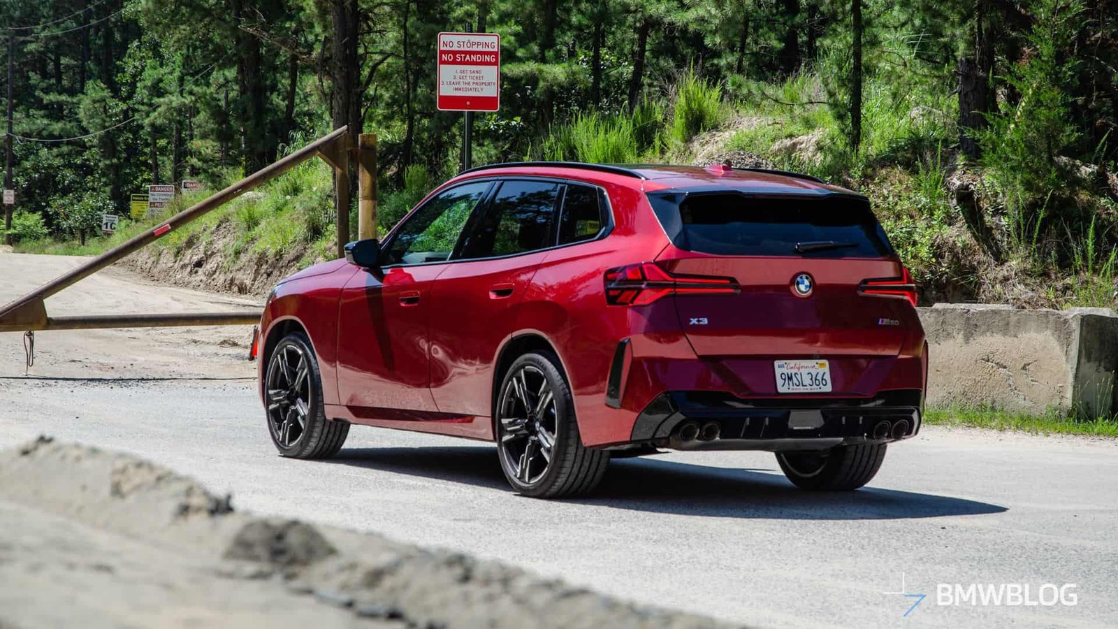 2025 BMW X3 M50 FIRE RED three quarter rear-end