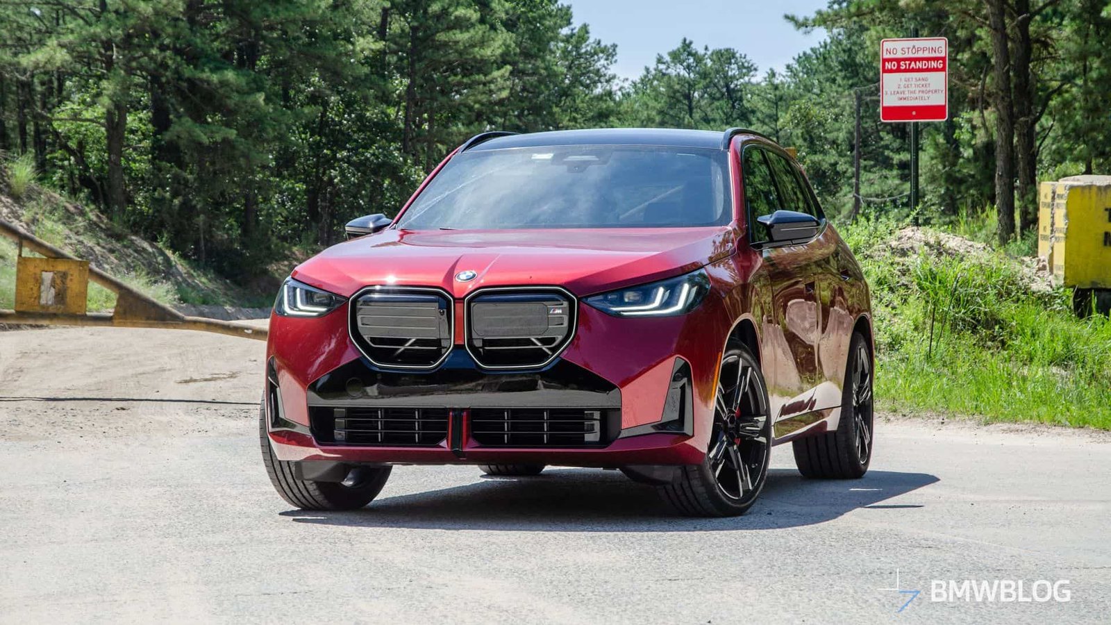 2025 BMW X3 M50 in Vegas Red Metallic front three-quarter view during road test