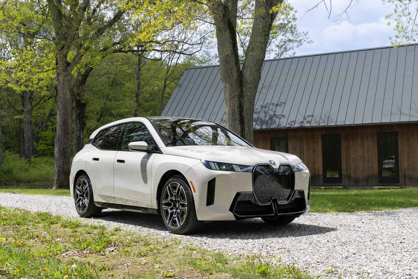 2026 BMW iX xDrive45 front three-quarter view with 21-inch wheels